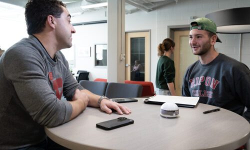 Junior, Miki Canak, interviews Alumnus, Andrew Peck. Photo Courtesy of Ric Damm.